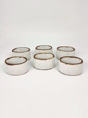 Set of 6 ceramic napkin ring holders in off white with brown edges and speckles